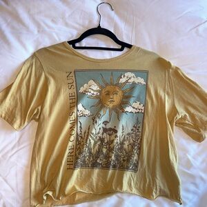 Yellow Graphic Tee with Sun and Floral Design